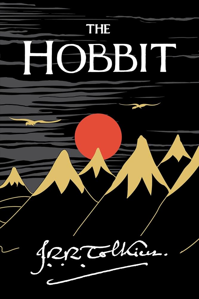 Cover of The Hobbit with an illustrated fantasy landscape.